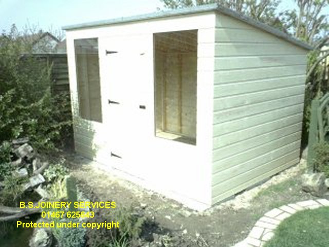 Pent shed with long front windows