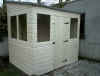 Reverse pent roof with door on low side
